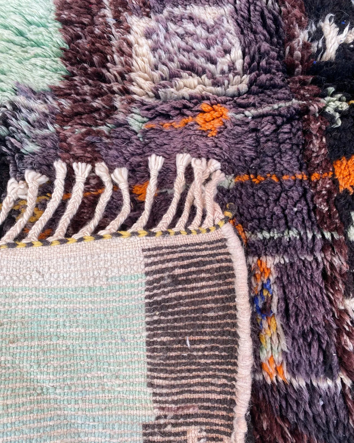 Mint and Plum Abstract Moroccan Rug, the back of the rug showing the hand-tied knots