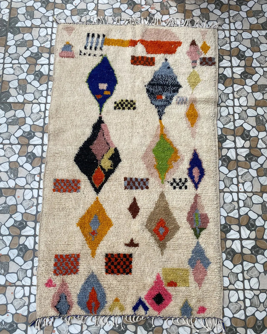 Painted Diamond Azilal Rug, full view laid flat on the workshop floor