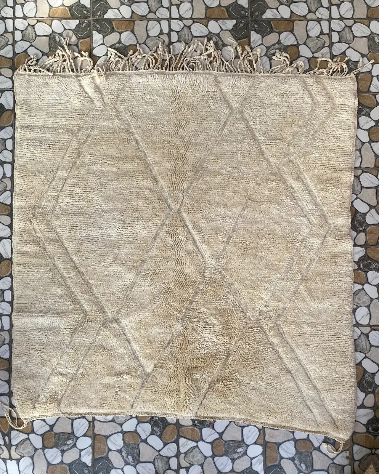 Cream Diamond Relief Beni Ourain Rug, full view laid flat on the workshop floor