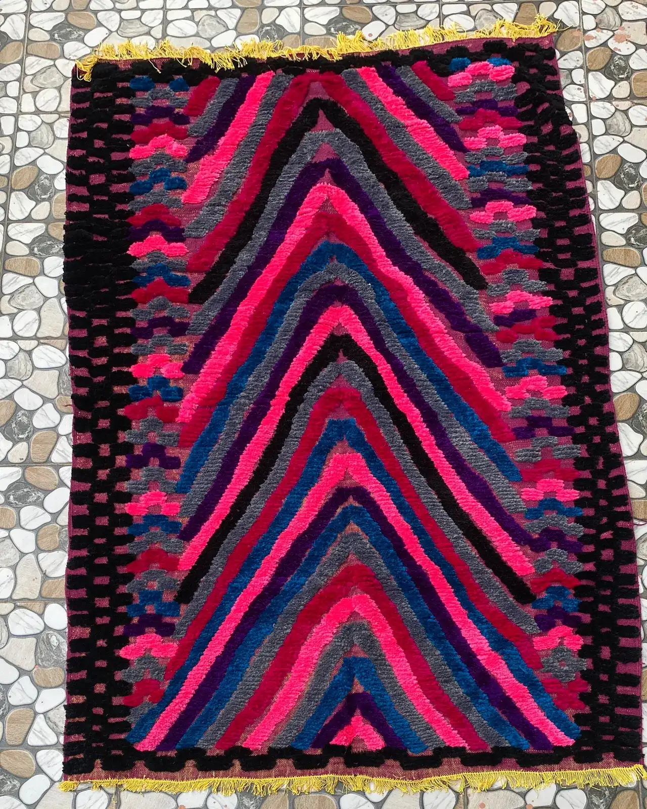 Pink and Blue Chevron Moroccan Rug, full view laid flat on the workshop floor