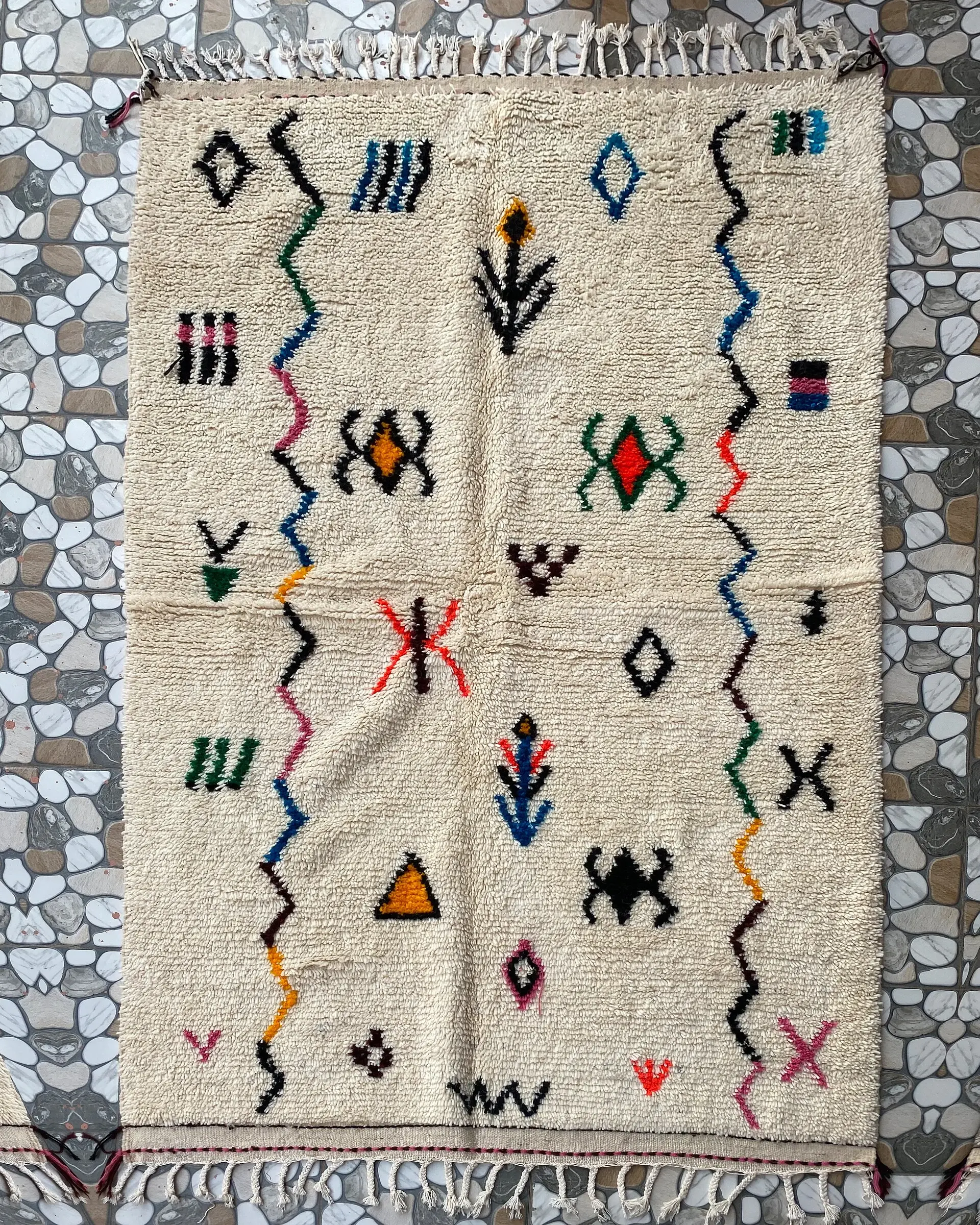 Berber Symbol Azilal Rug, full view laid flat on the workshop floor