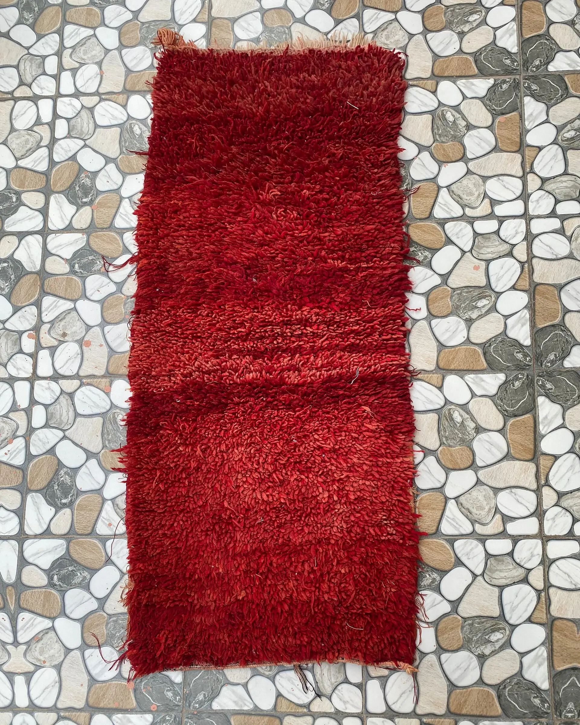 Red Shag Moroccan Runner, full view laid flat on the workshop floor