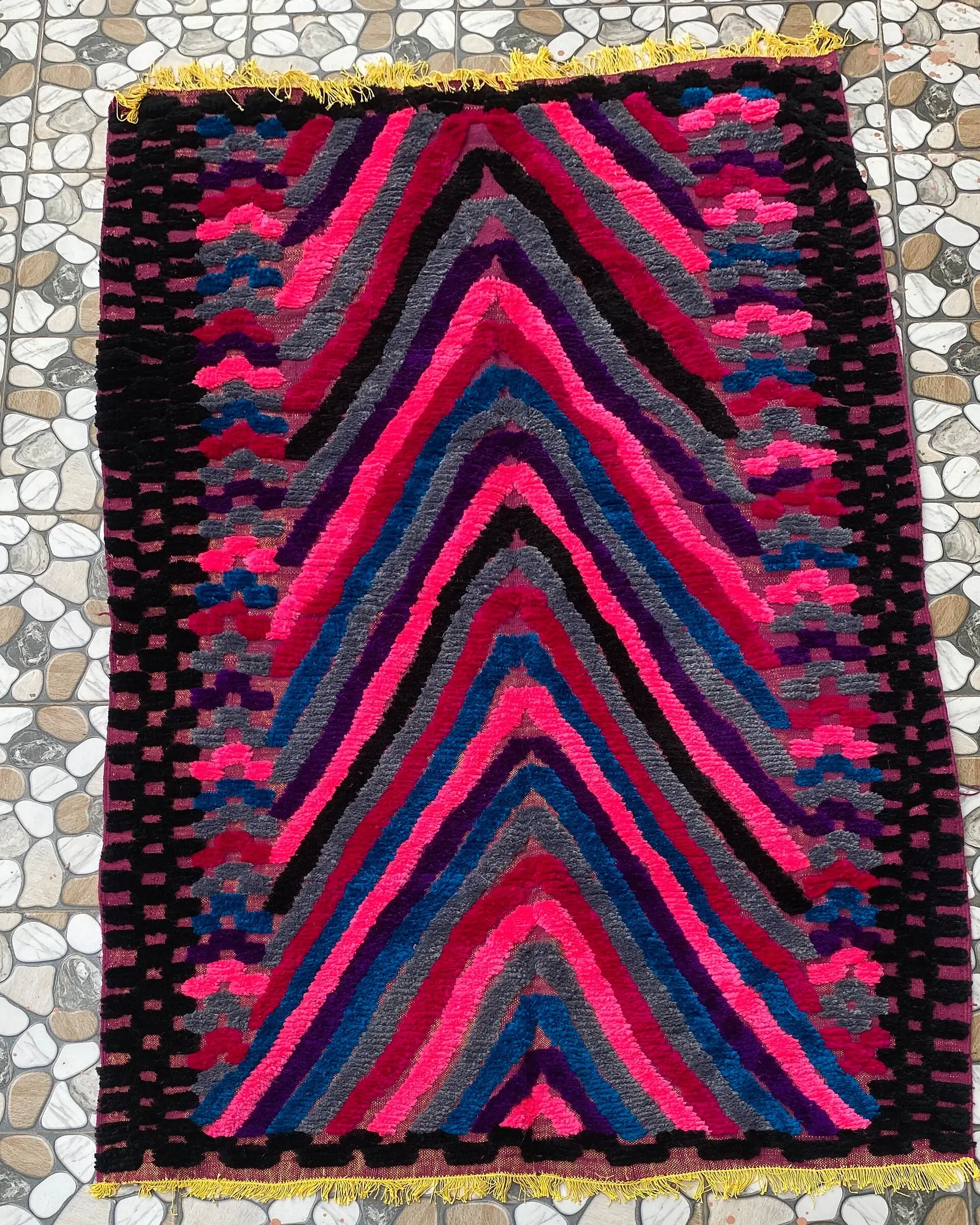 Pink and Blue Chevron Moroccan Rug, full view laid flat on the workshop floor