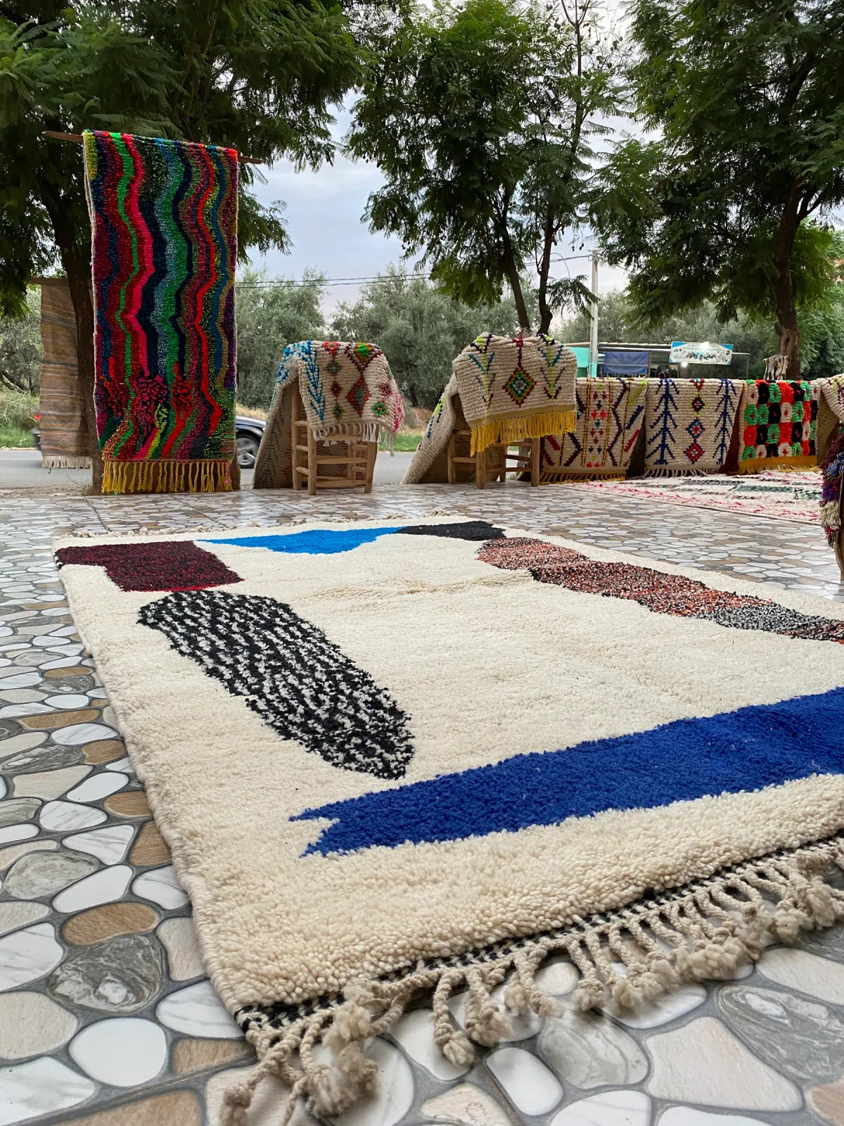 A hand-knotted ZenRug laid out in the workshop courtyard in Morocco