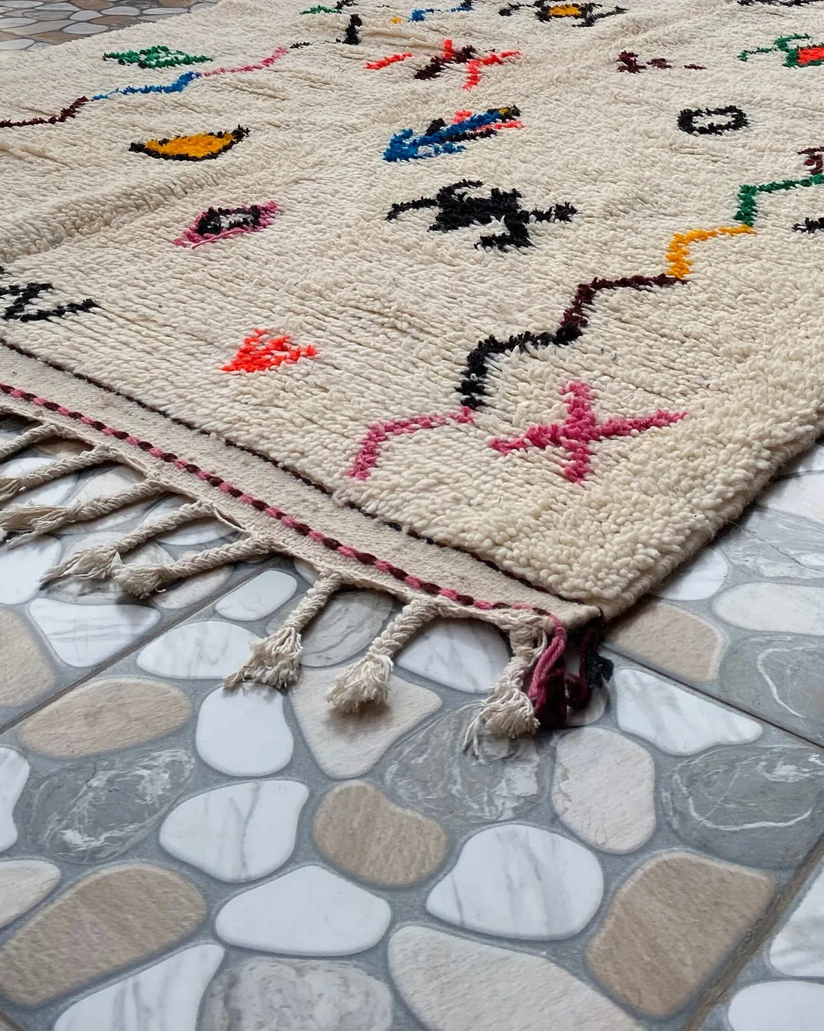 Berber Symbol Azilal Rug, seen at an angle on the workshop floor