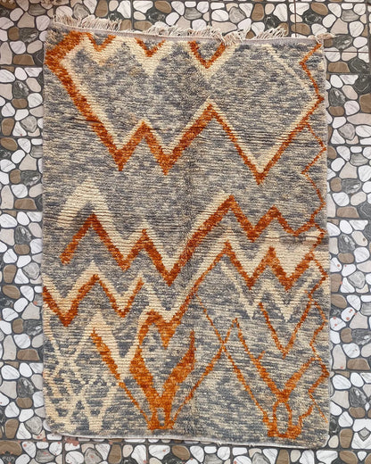 Gray and Orange Zigzag Moroccan Rug, full view laid flat on the workshop floor