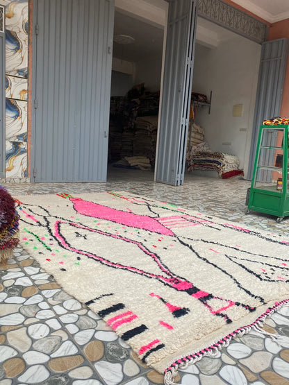Hot Pink and Ivory Azilal Rug, seen at an angle on the workshop floor
