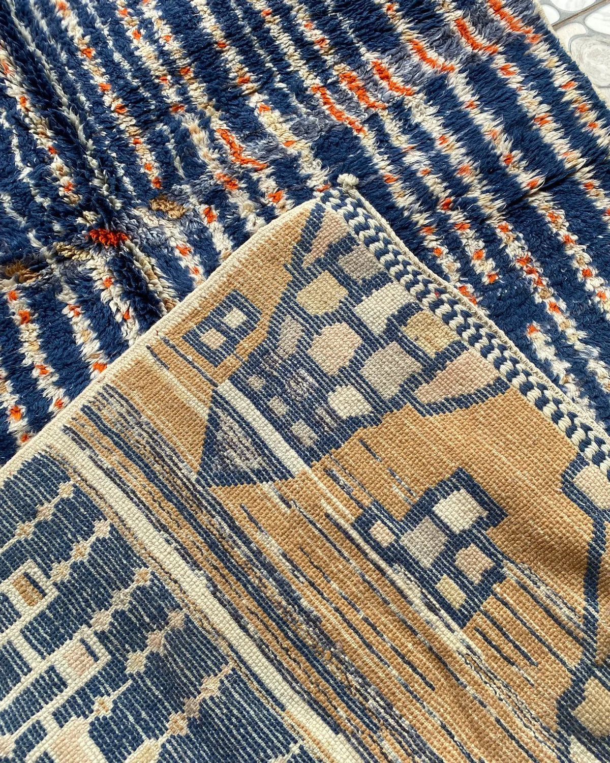 Navy Blue Stripe Moroccan Rug, the back of the rug showing the hand-tied knots