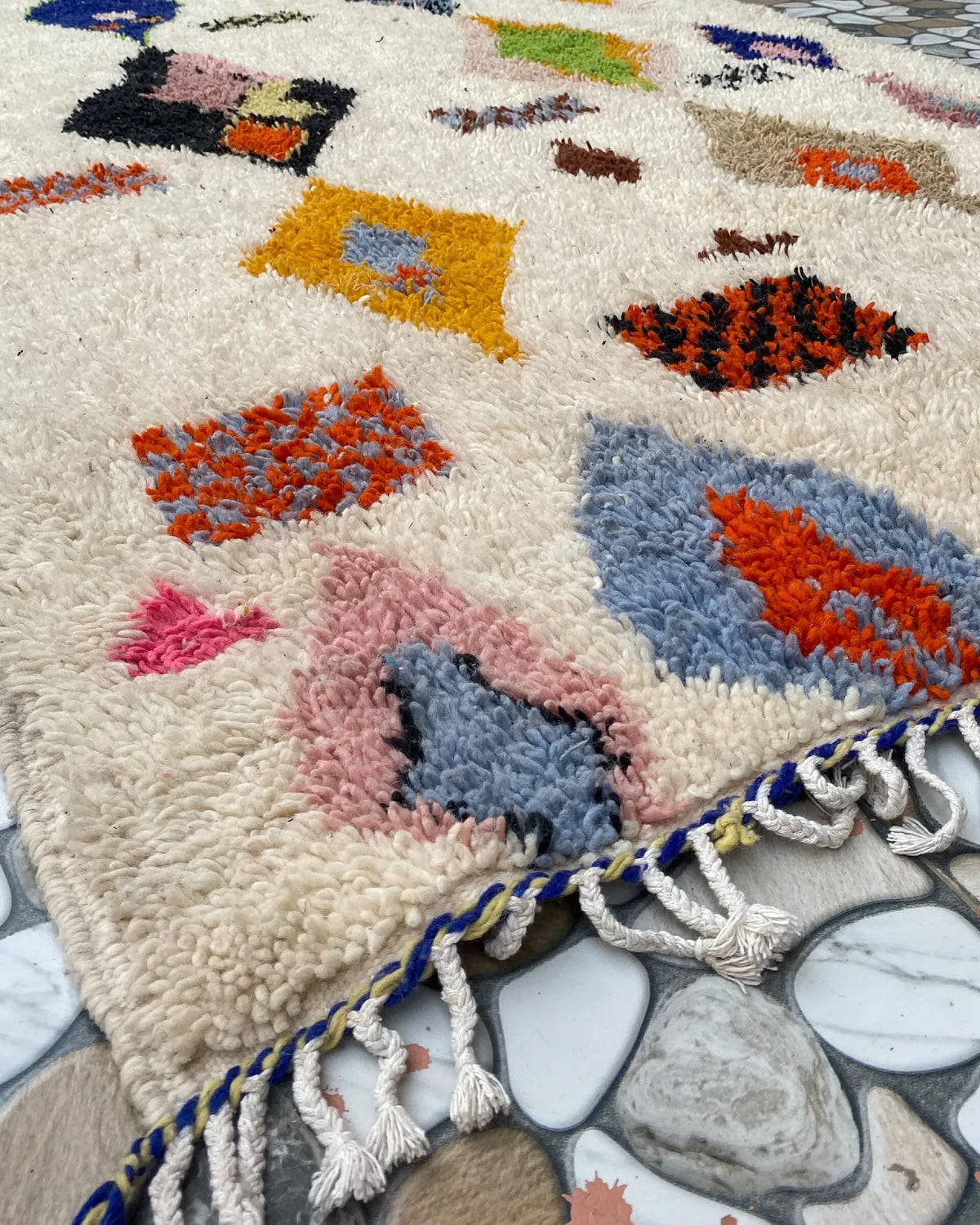 Painted Diamond Azilal Rug, seen at an angle on the workshop floor