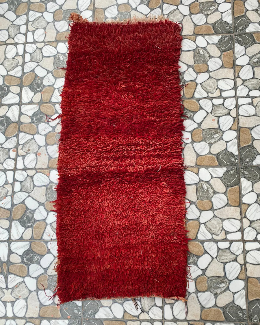 Red Shag Moroccan Runner, full view laid flat on the workshop floor